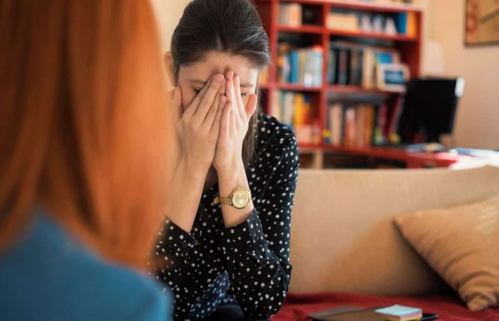 woman talks to an alcoholic sibling about getting help